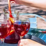 Jug and glasses with sangria beverage on the table in street cafe in center of Barcelona. Spain.